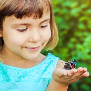 Mighty Minibeasts - GRH Training - girl with butterfly